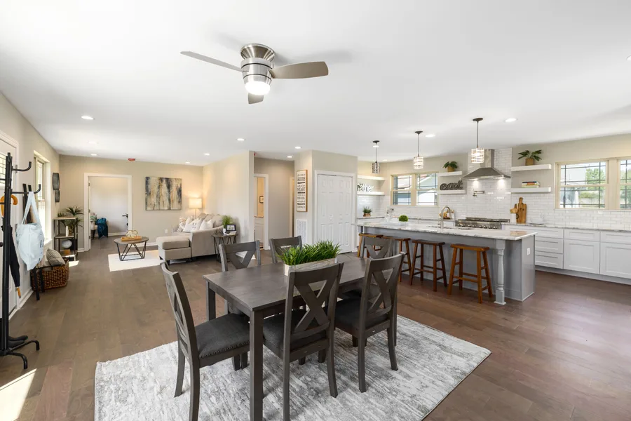 Open plan living, dining and kitchen with timber floors