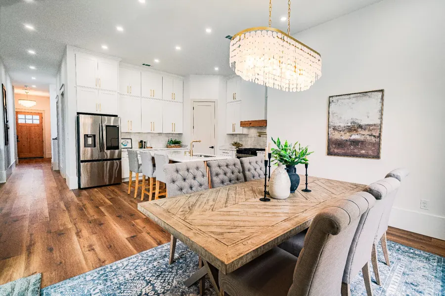 Modern kitchen with a marble island and timber floors